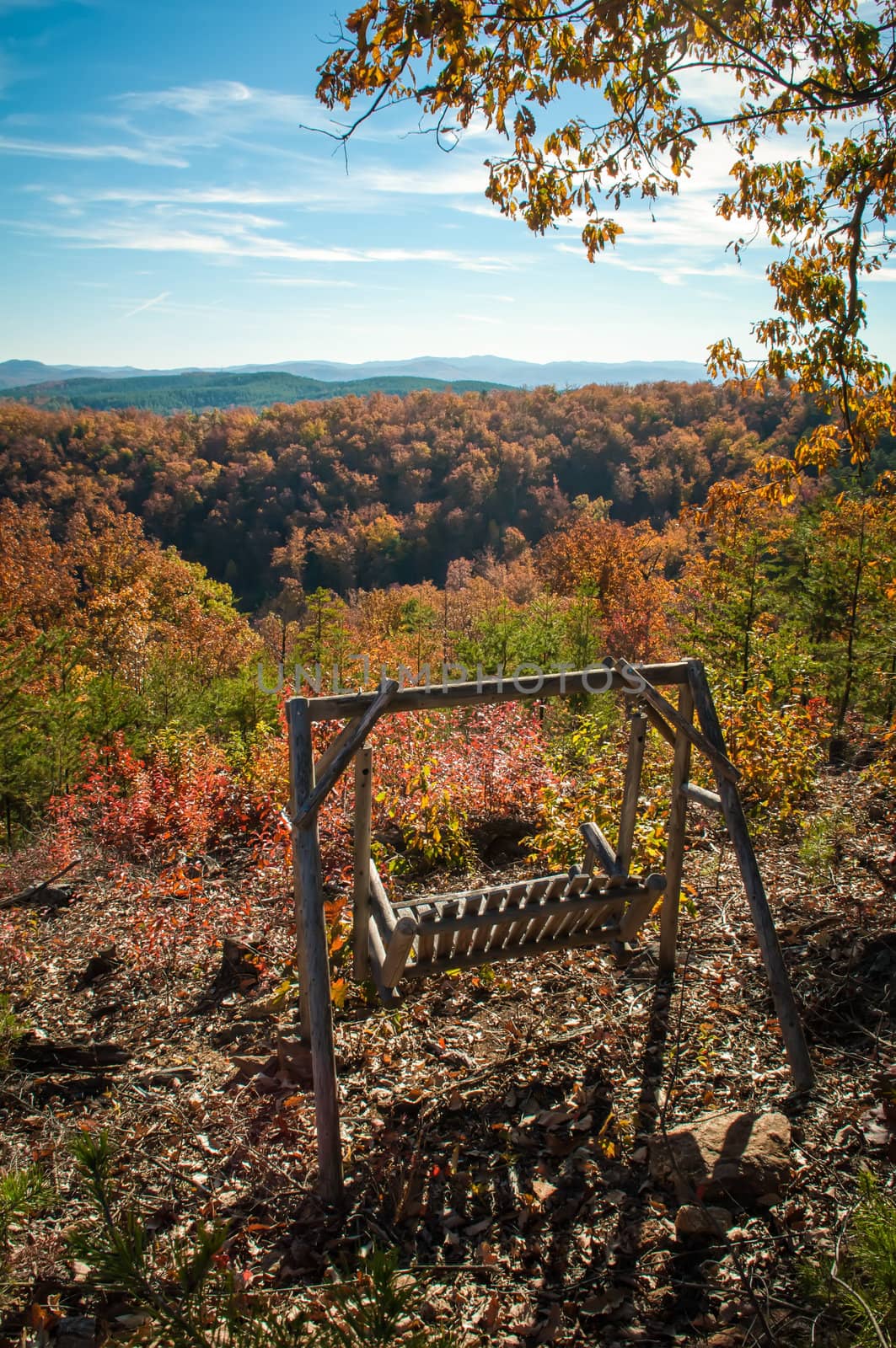 swing bench overlooking mountains in fall