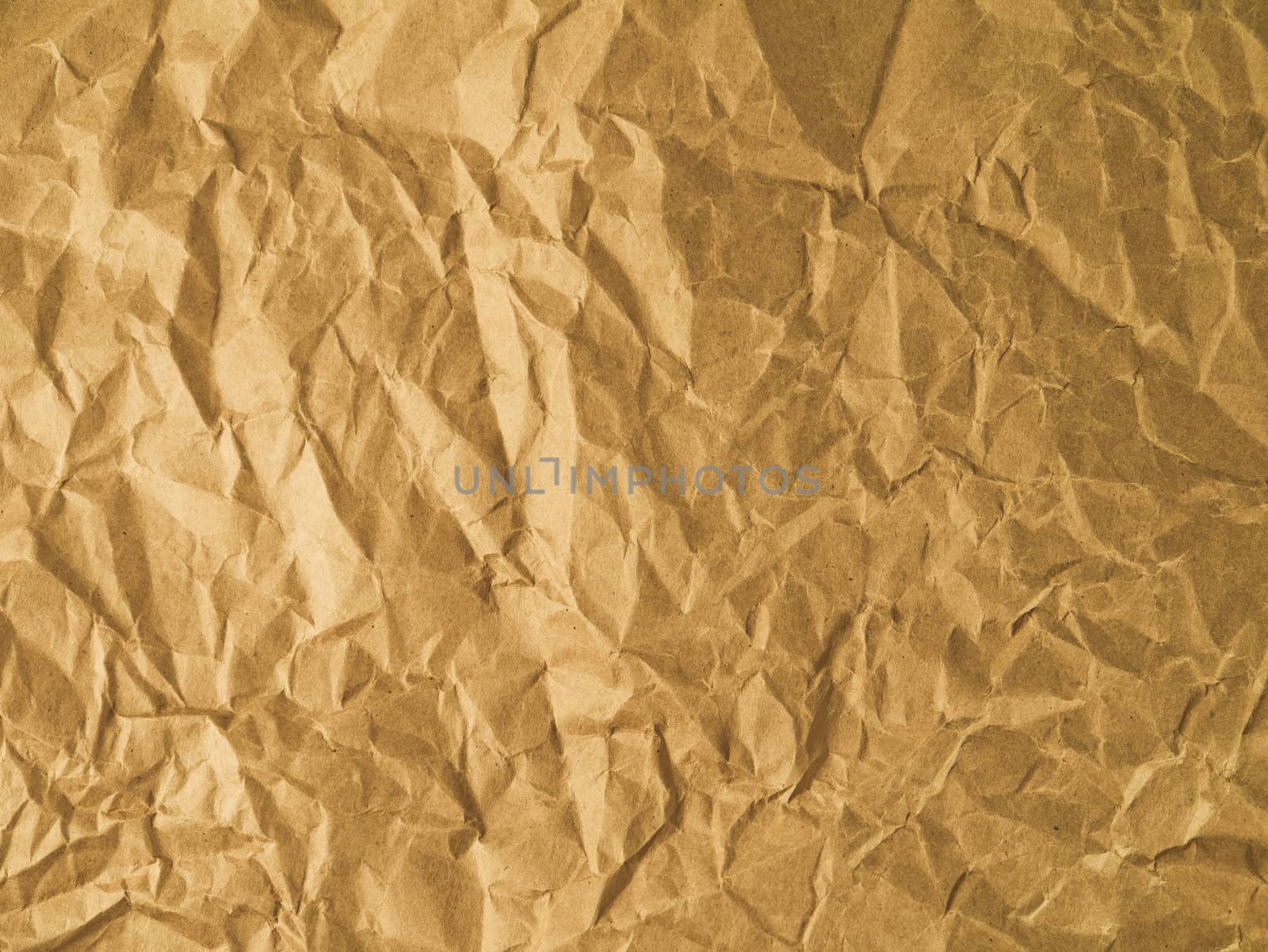 Yellow wrinkled paper as a background