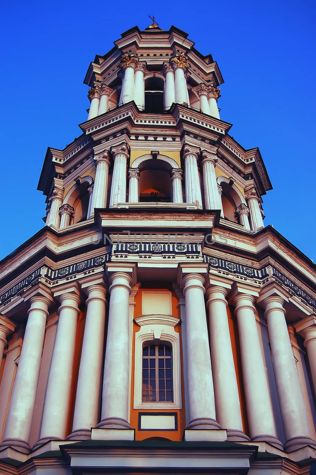 image of bell tower in the Kiev lavra of the Caves on the blue background