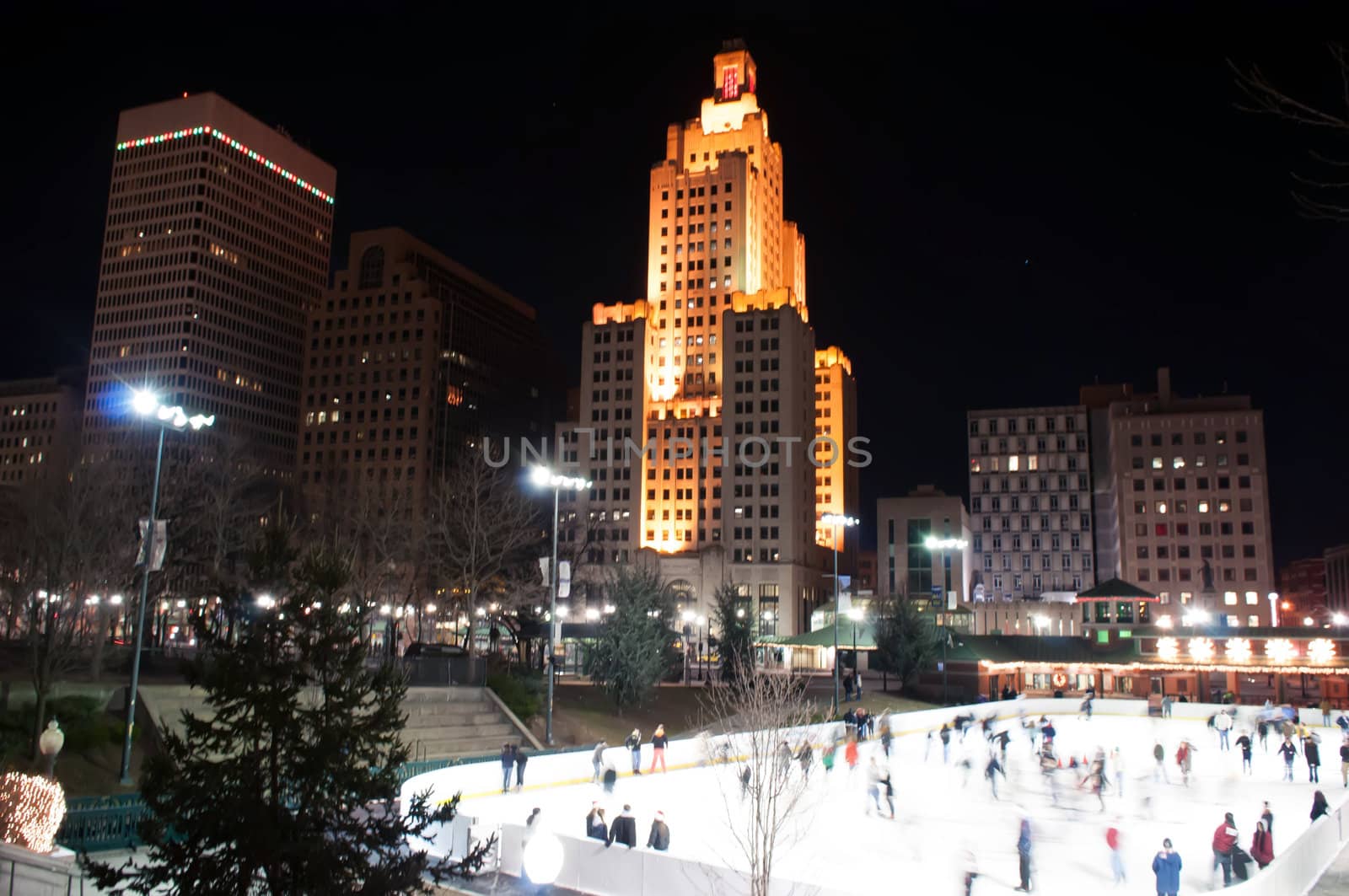 providence on a cold december evening with people ice skating