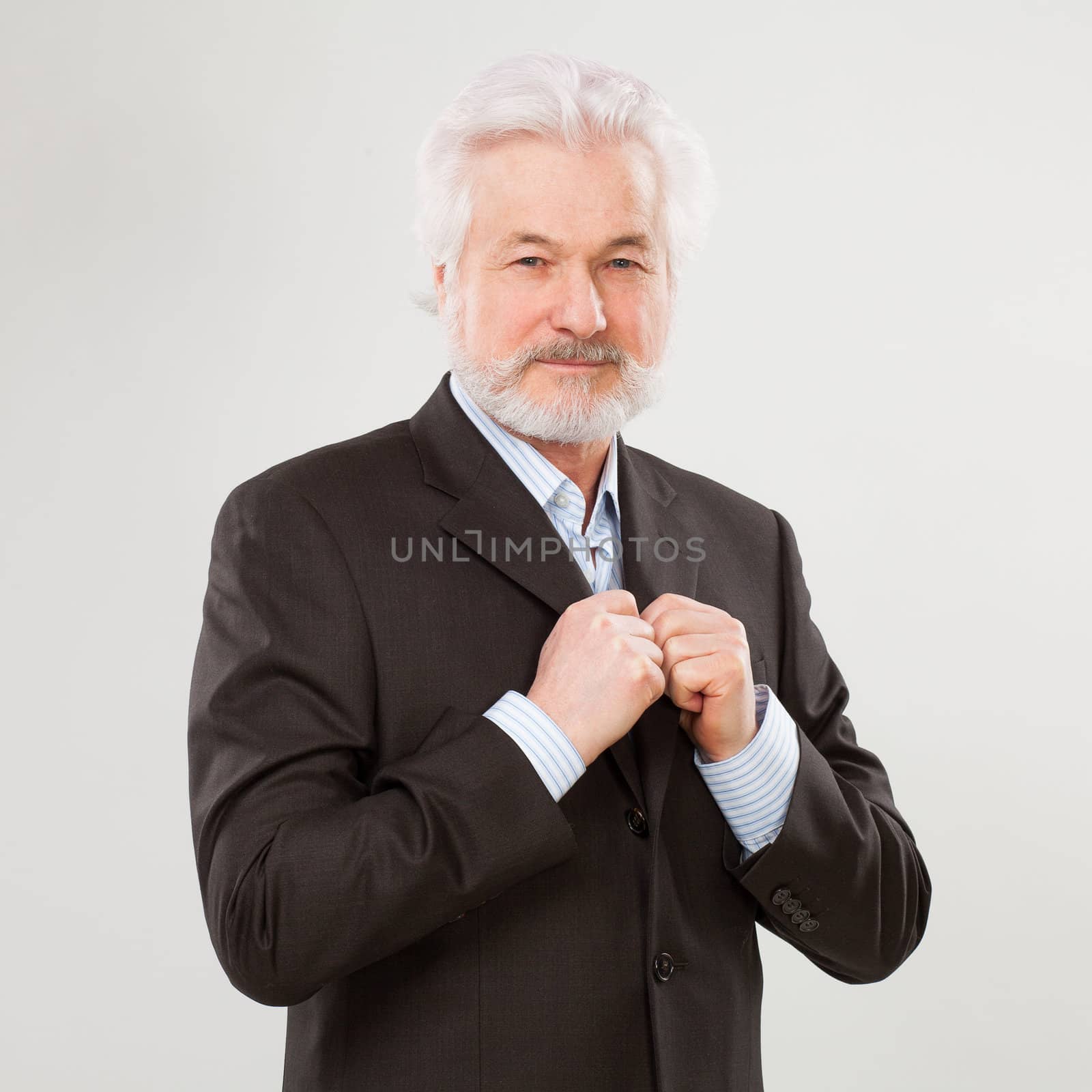 Handsome elderly man with beard isolated over white background