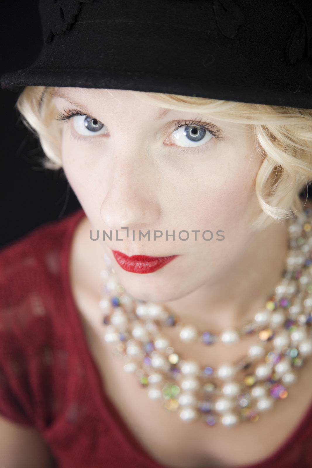 A Wealthy Seductive Woman looking right at you ! A little Vintage look with the Hat and the shiny necklace.