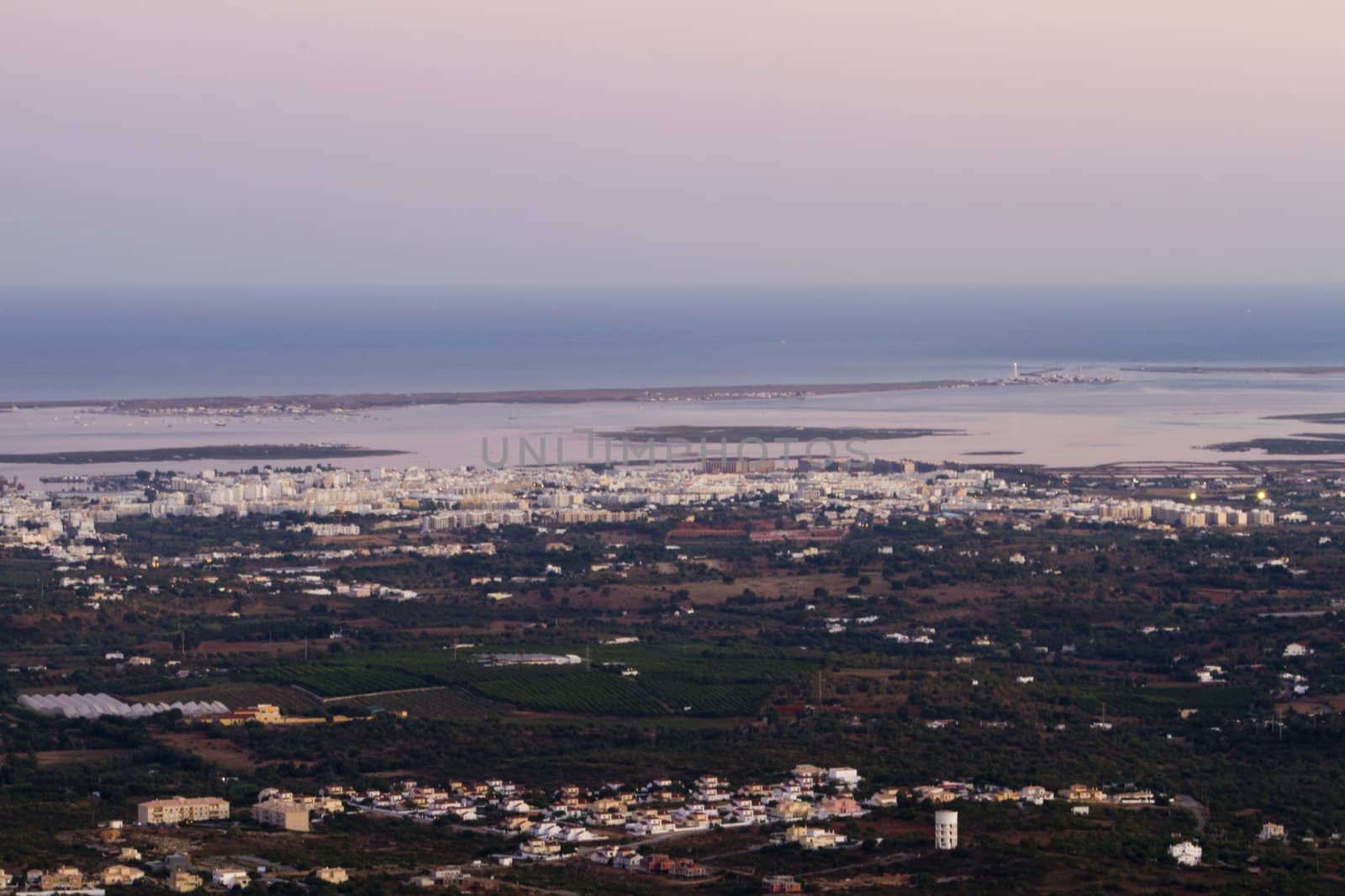 Wide view of the area of Faro city, located on the Algarve, Portugal at sunset.