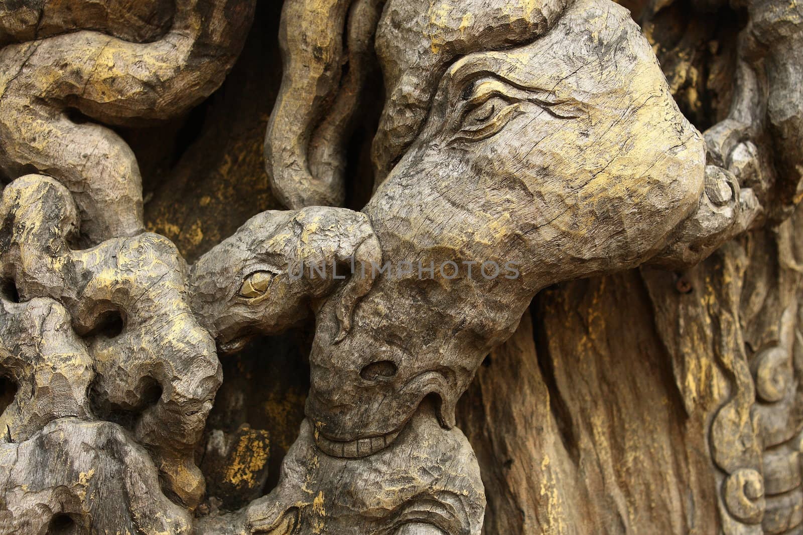 Woodcarving in Thailand - a horse's head by cococinema