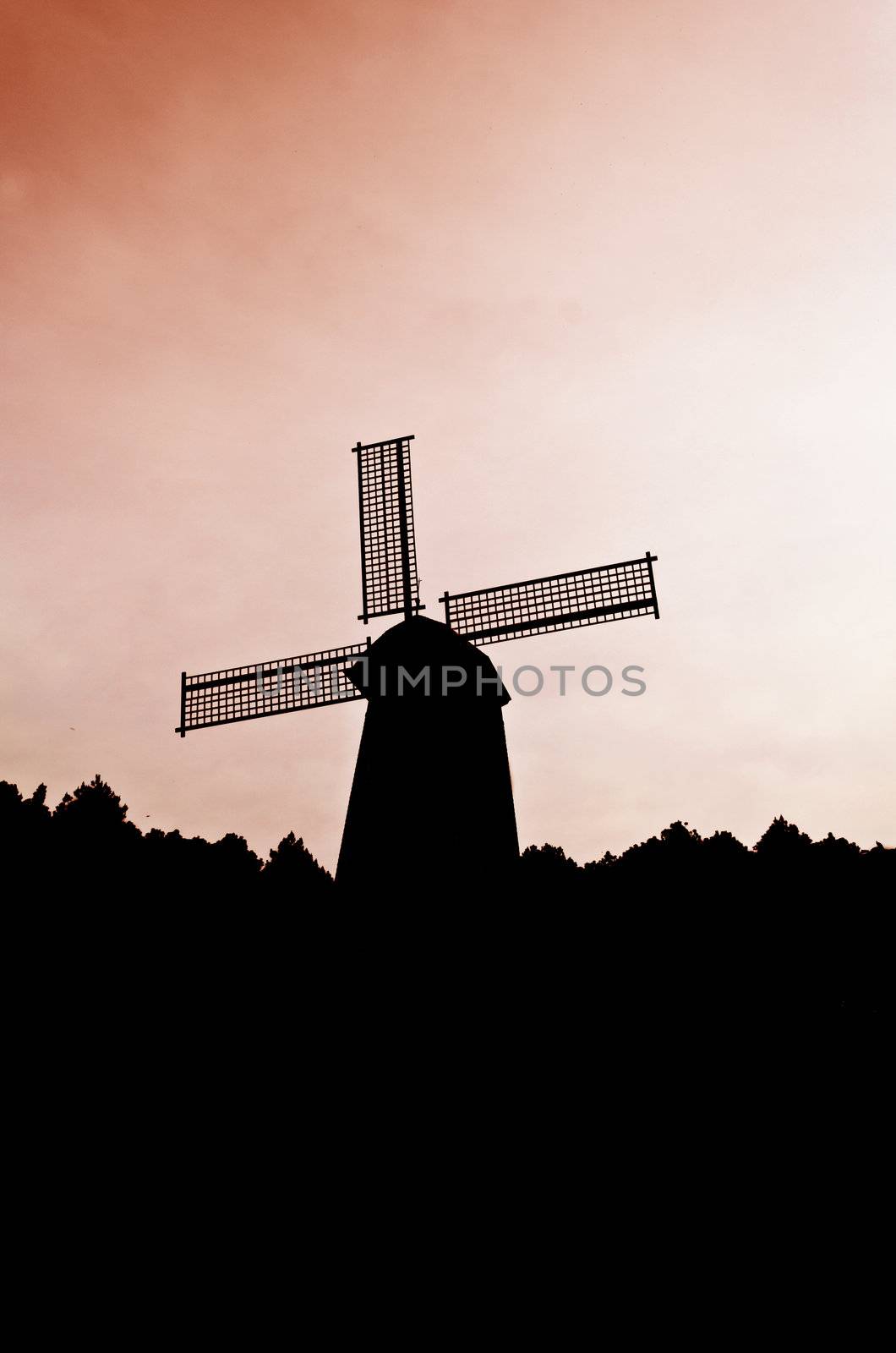 silhouette Wind generator on colorful sky