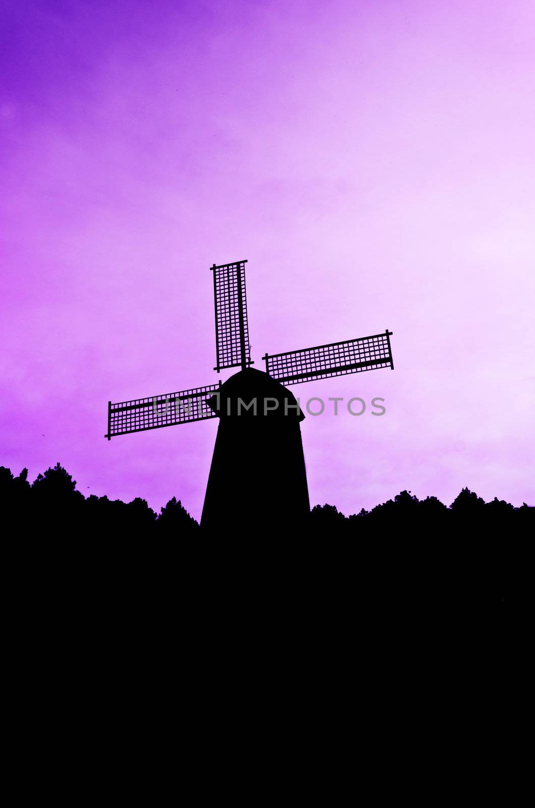 silhouette Wind generator on colorful sky