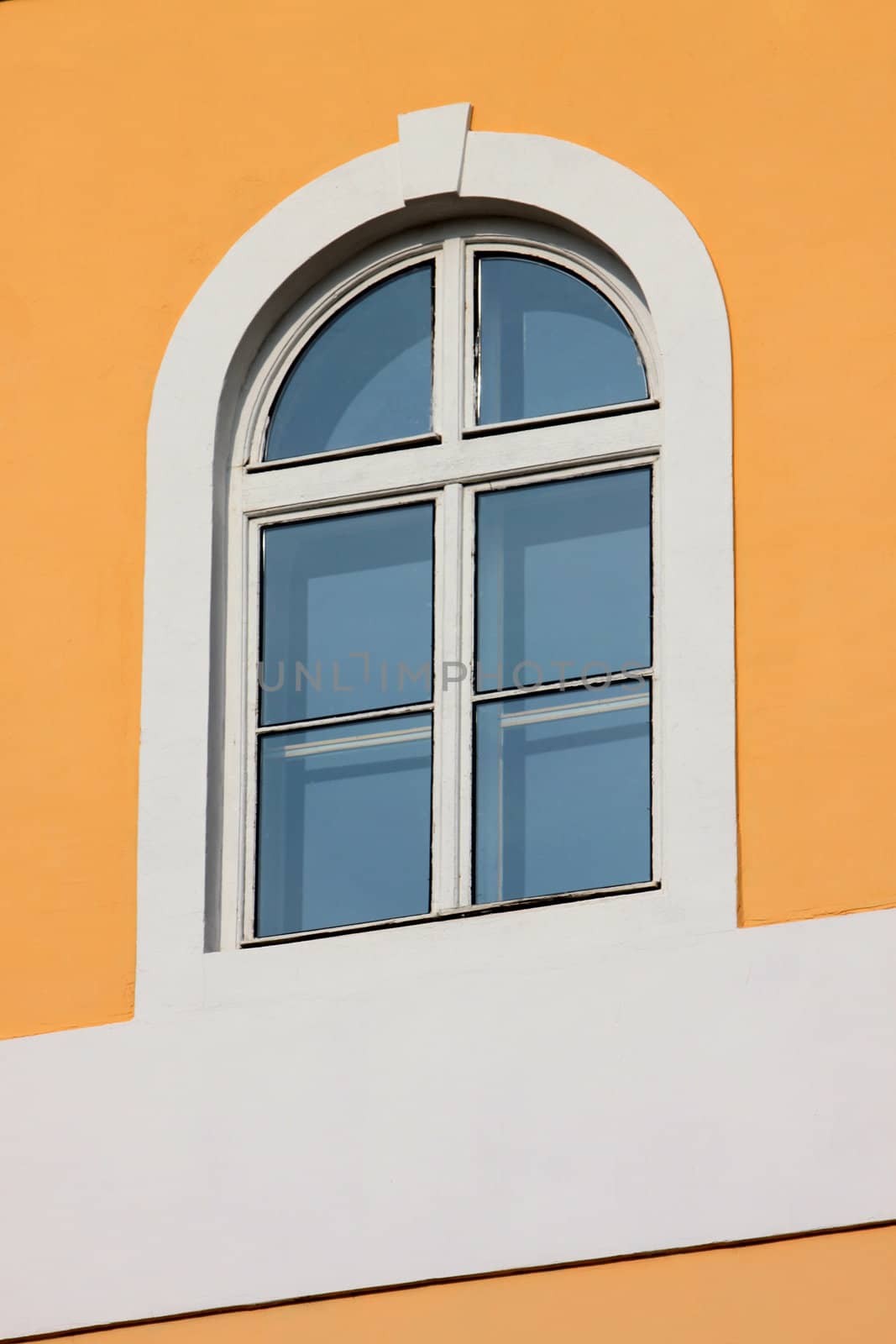 close up of window on orange wall