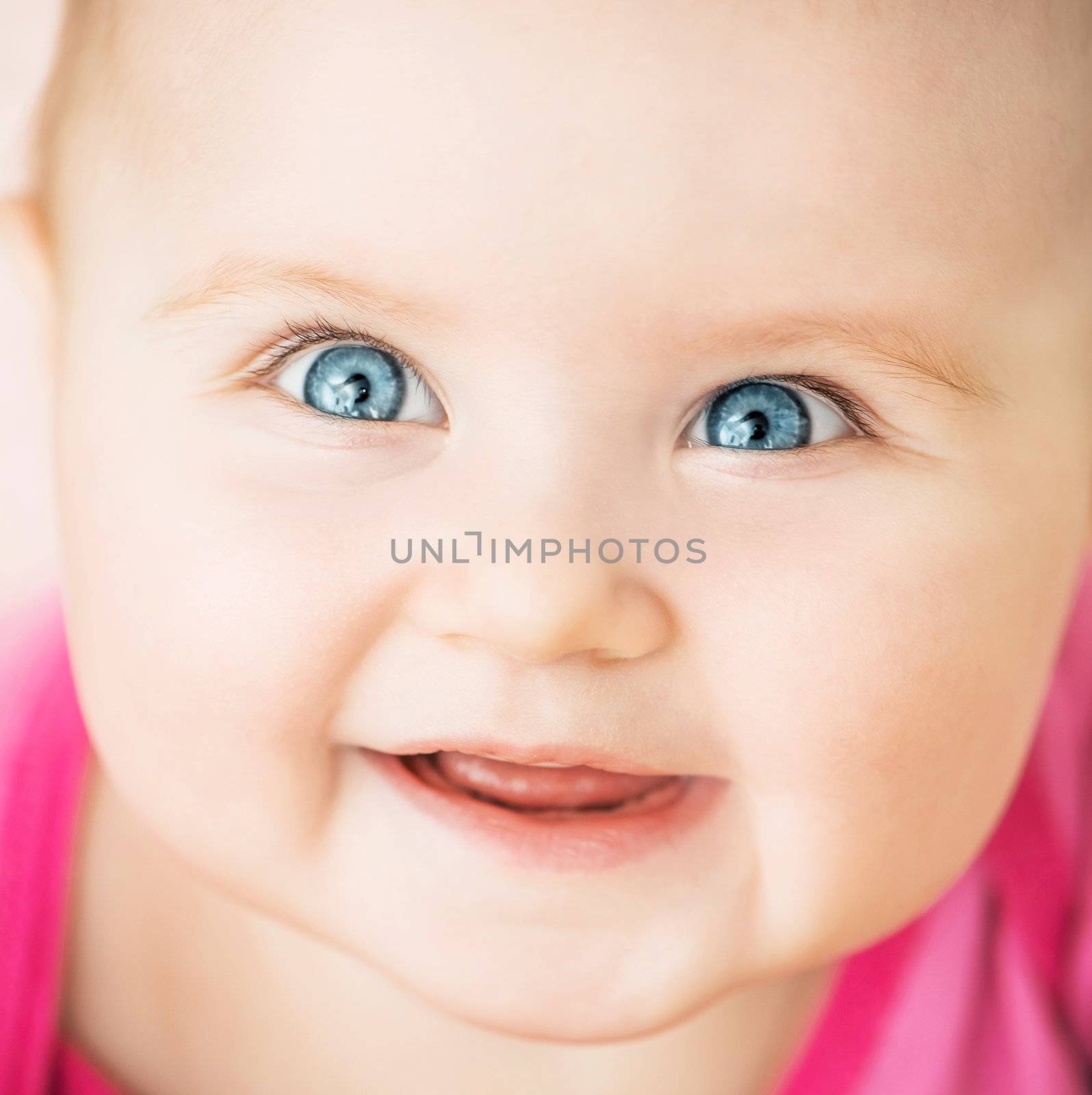 bright closeup portrait of smiling baby