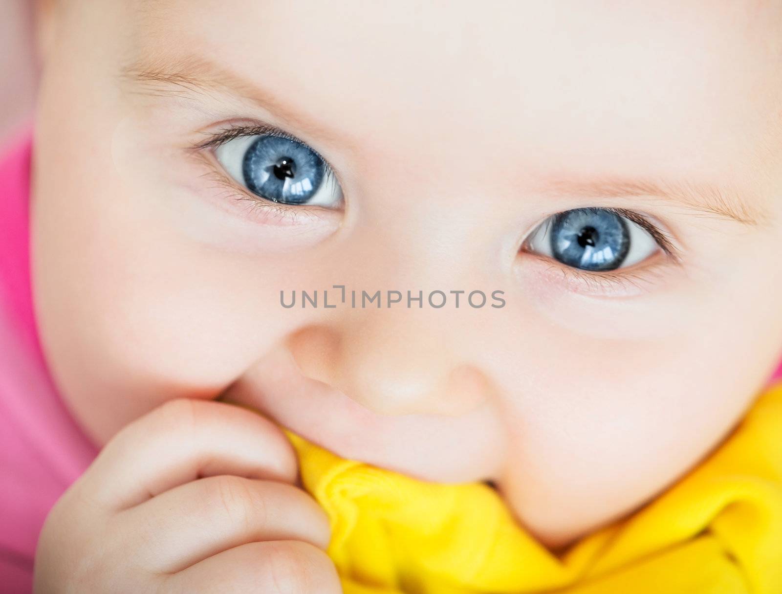 bright closeup portrait of funny adorable baby