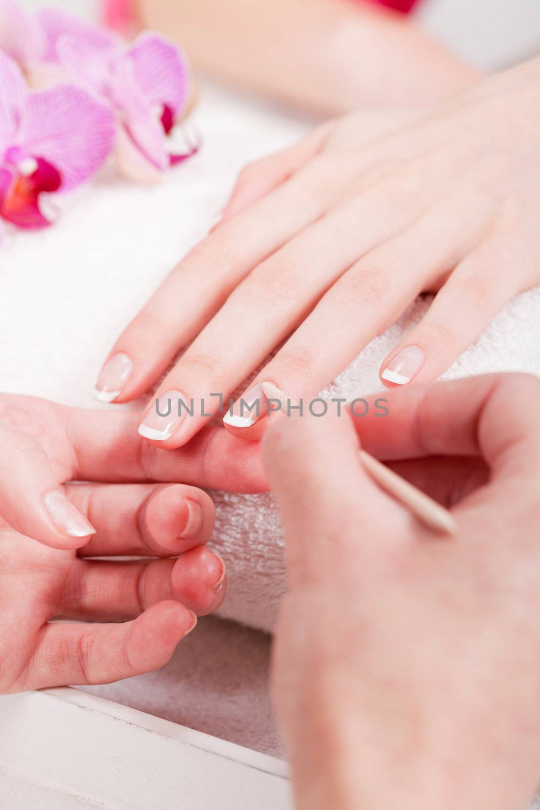 professional manicurist doing a manicure natural look 