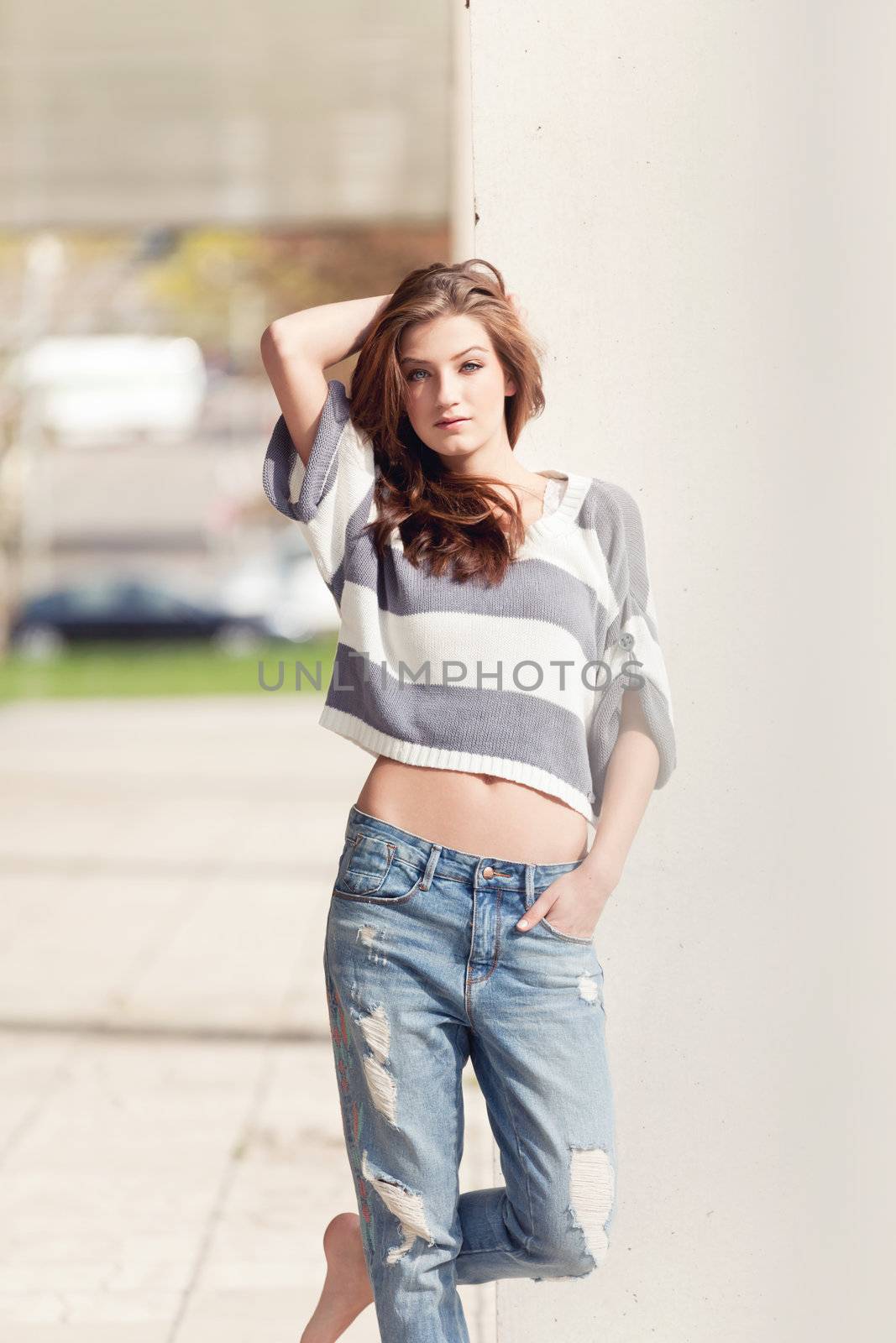 attractive young brunette woman barefoot in summertime outdoor