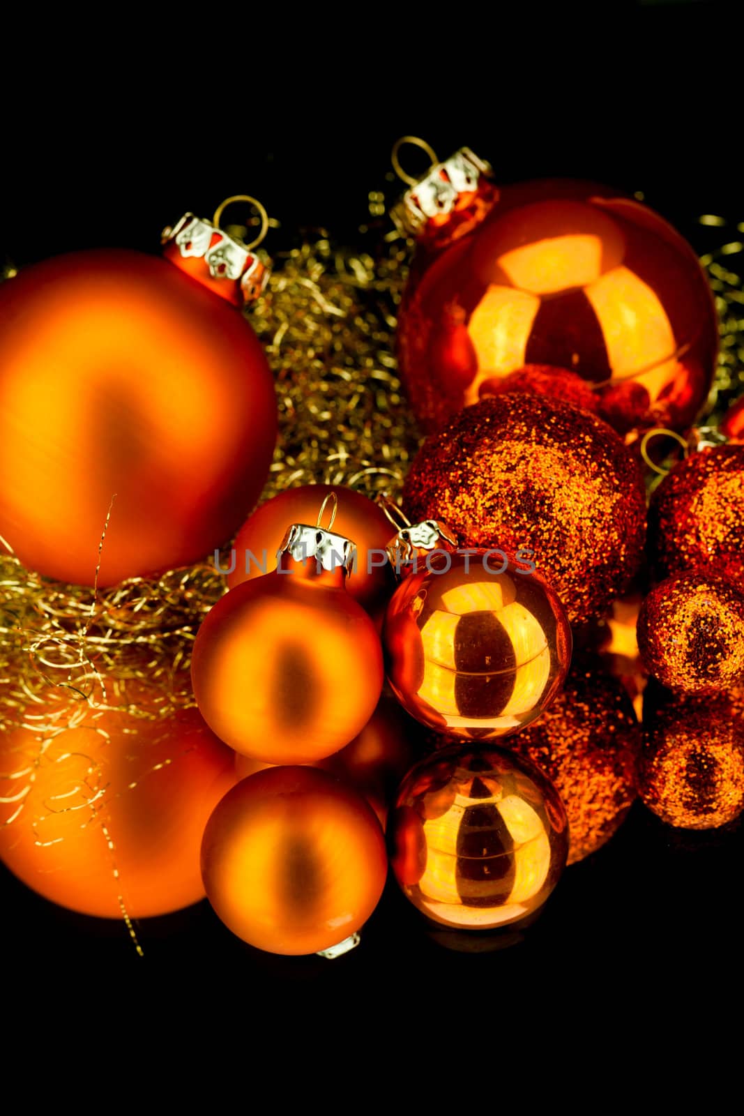 christmas decoration in orange and gold on black background