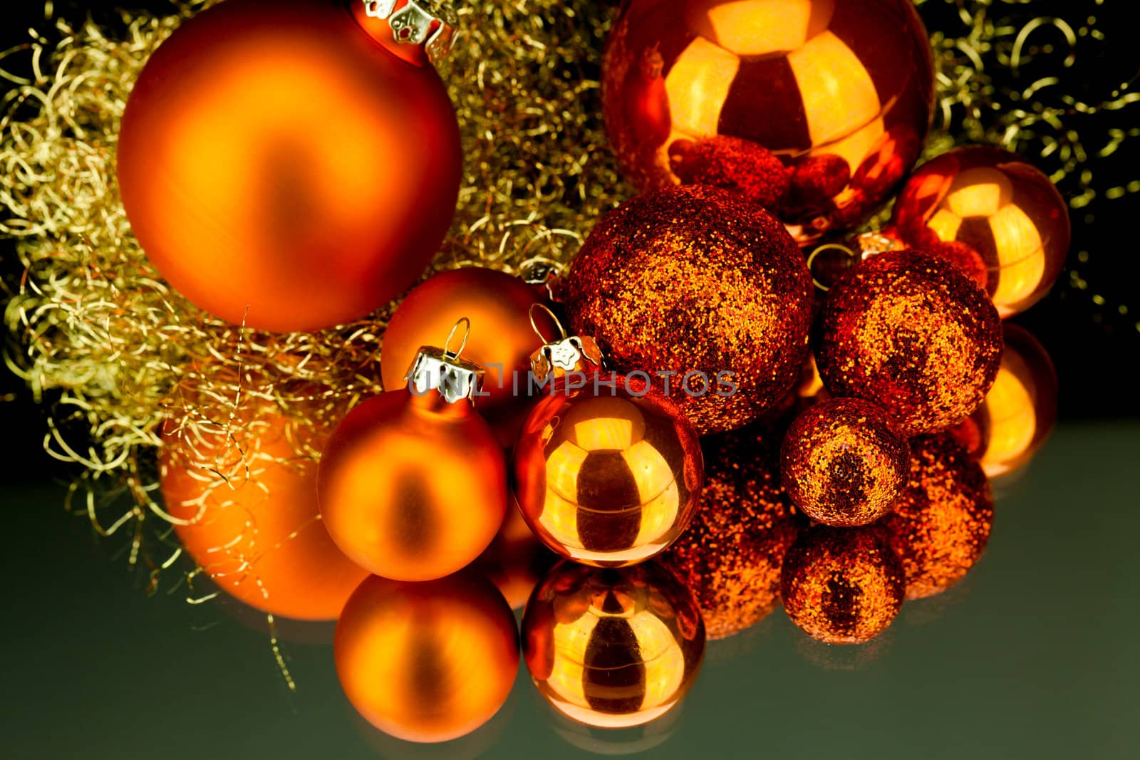 christmas decoration in orange and gold on black background