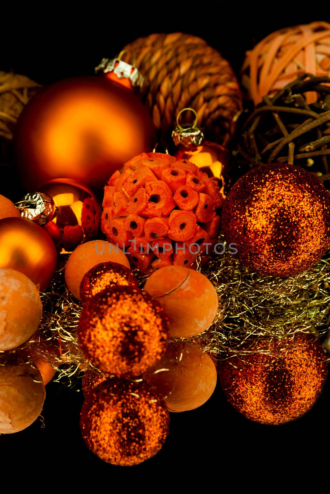 christmas decoration in orange and gold on black background