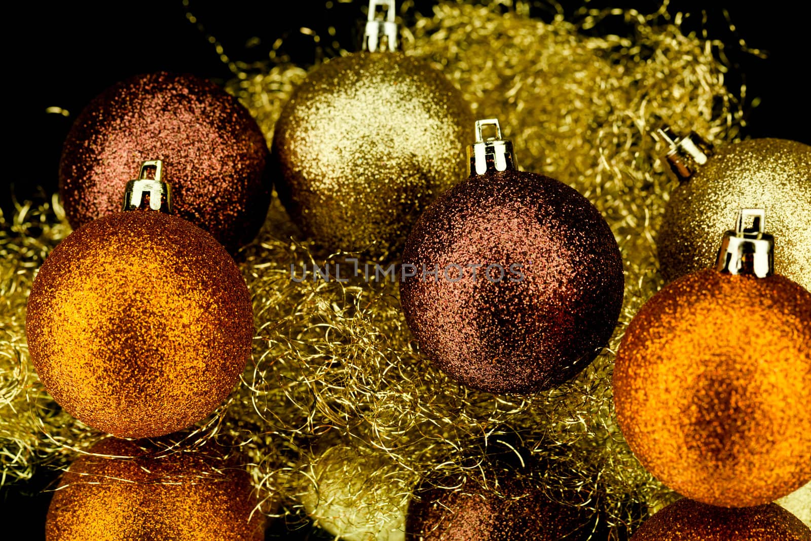 christmas decoration in orange and gold on black background