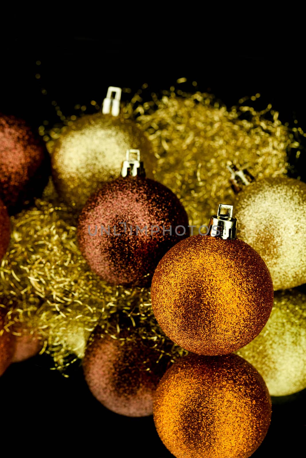 christmas decoration in orange and gold on black background