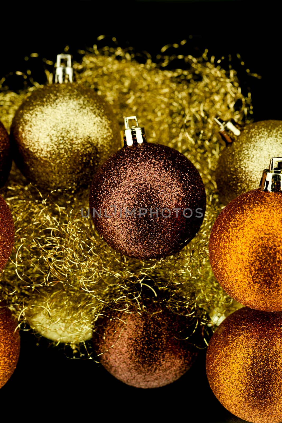 christmas decoration in orange and gold on black background