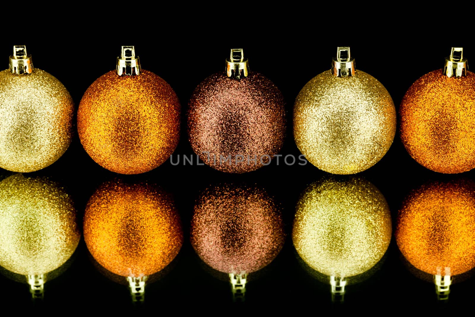 christmas decoration in orange and gold on black background