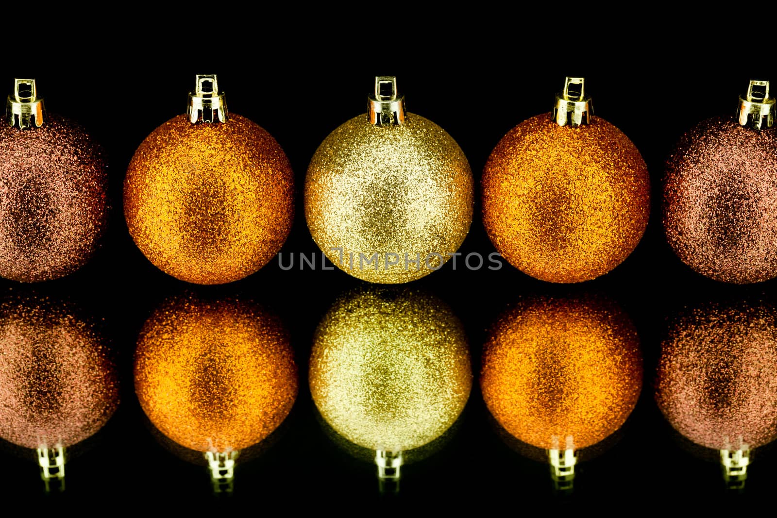 christmas decoration in orange and gold on black background