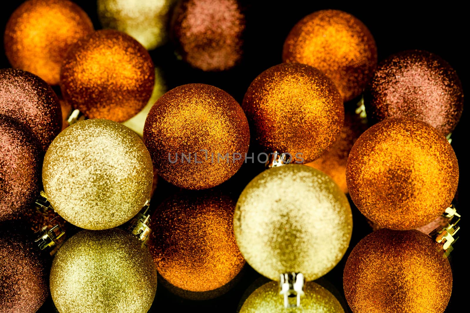 christmas decoration in orange and gold on black background