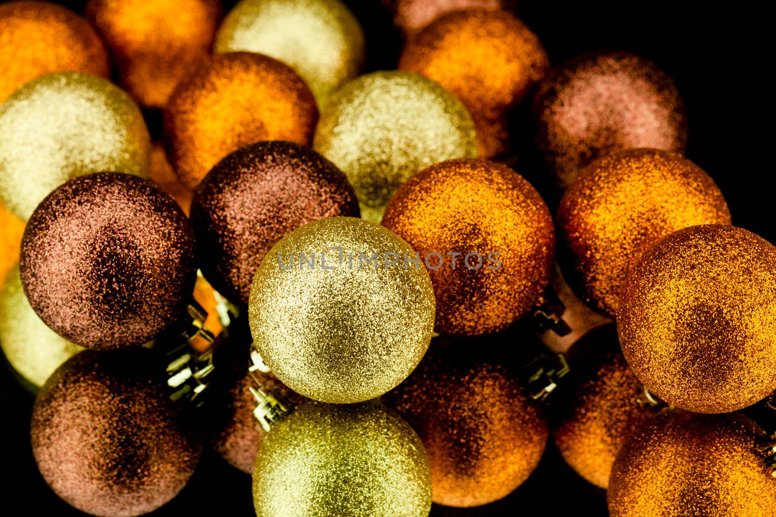 christmas decoration in orange and gold on black background