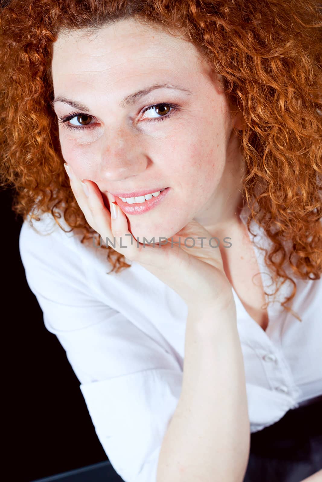 attractive young redhead woman emotion portrait ob black 