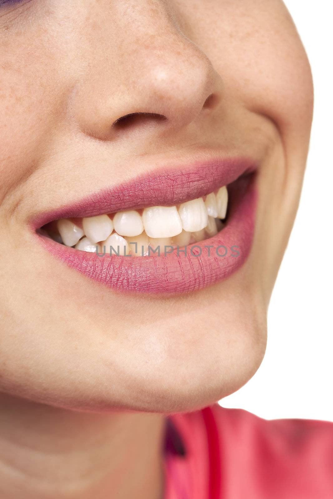 Close View of a young woman smiling. Makeup by Irene Prowell - professional freelance makeup artist.