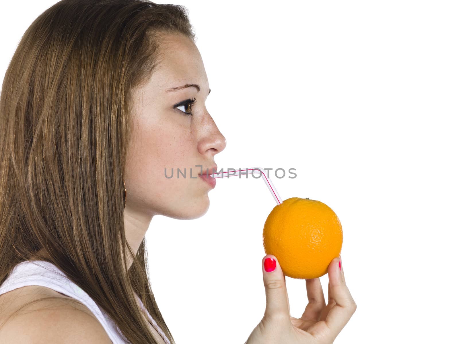 Close-up profile view of a teenage girl drinking orange against white background.