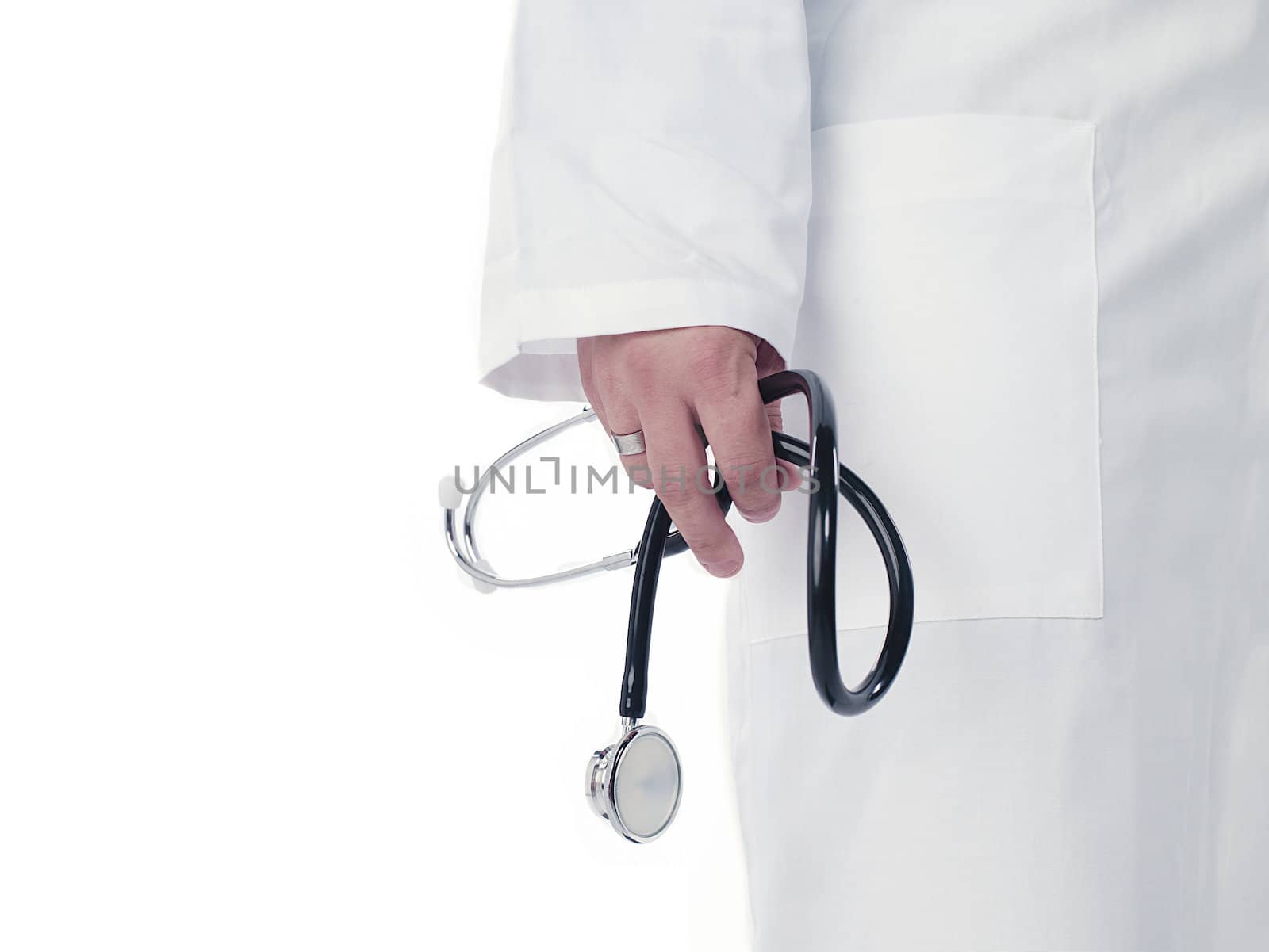 Cropped image of a doctor holding stethoscope over white background. Model: Derek Gerhardt
