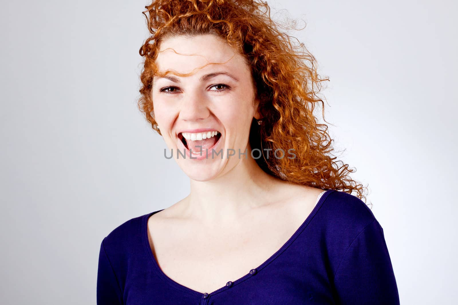 attractive young redhead woman smiling laughing emotion portrait