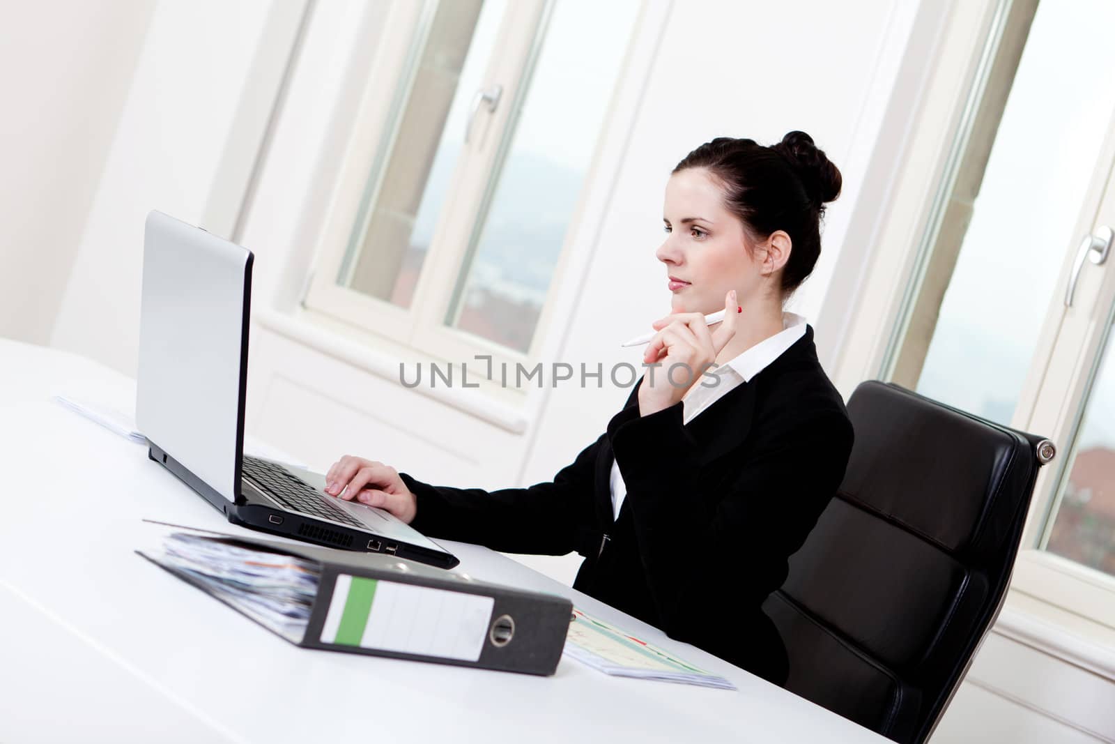 young successful business woman working on computer in office