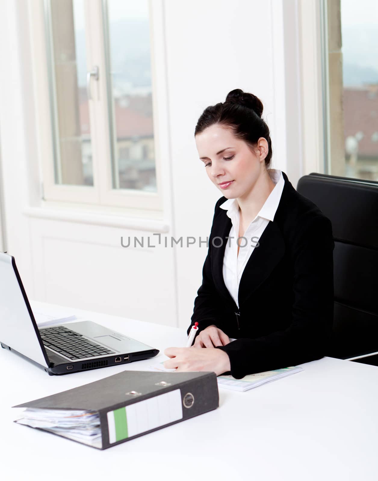 young successful business woman working on computer in office
