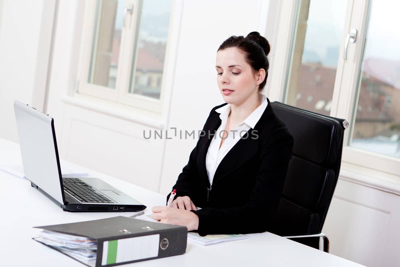 young successful business woman working on computer in office
