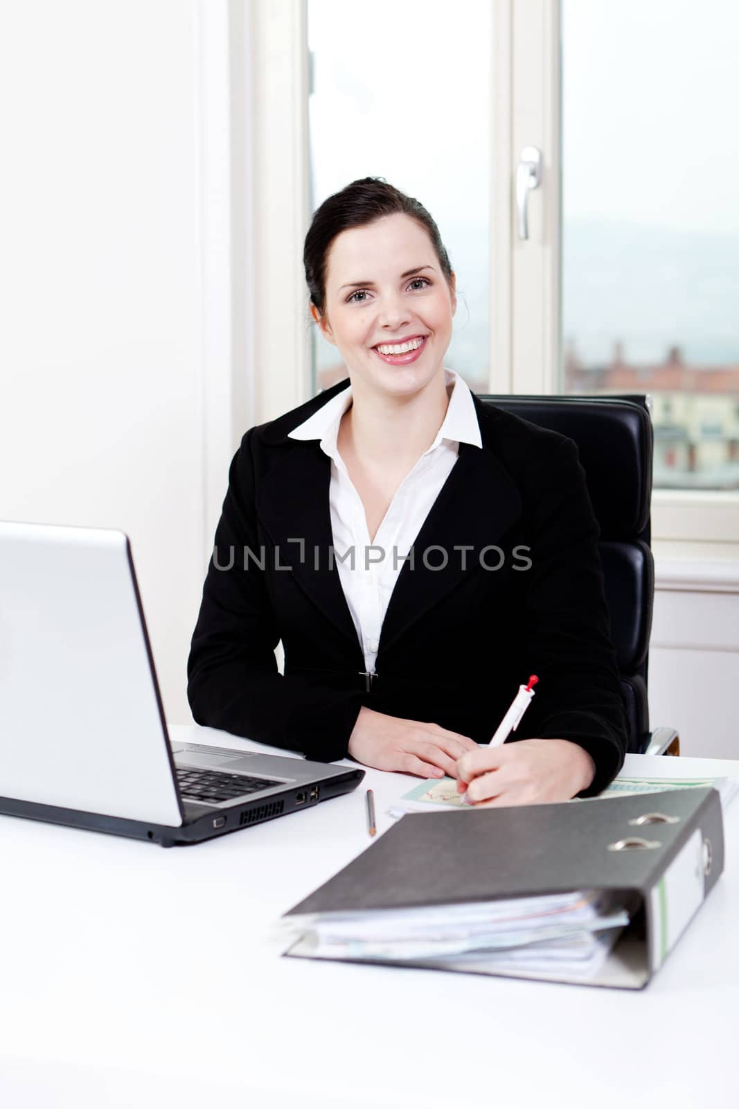 young successful business woman working on computer in office