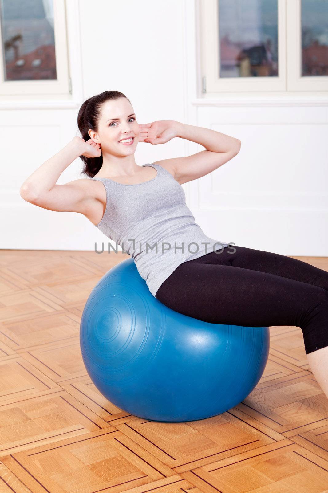 attractive young woman doing sit ups at home sport workout