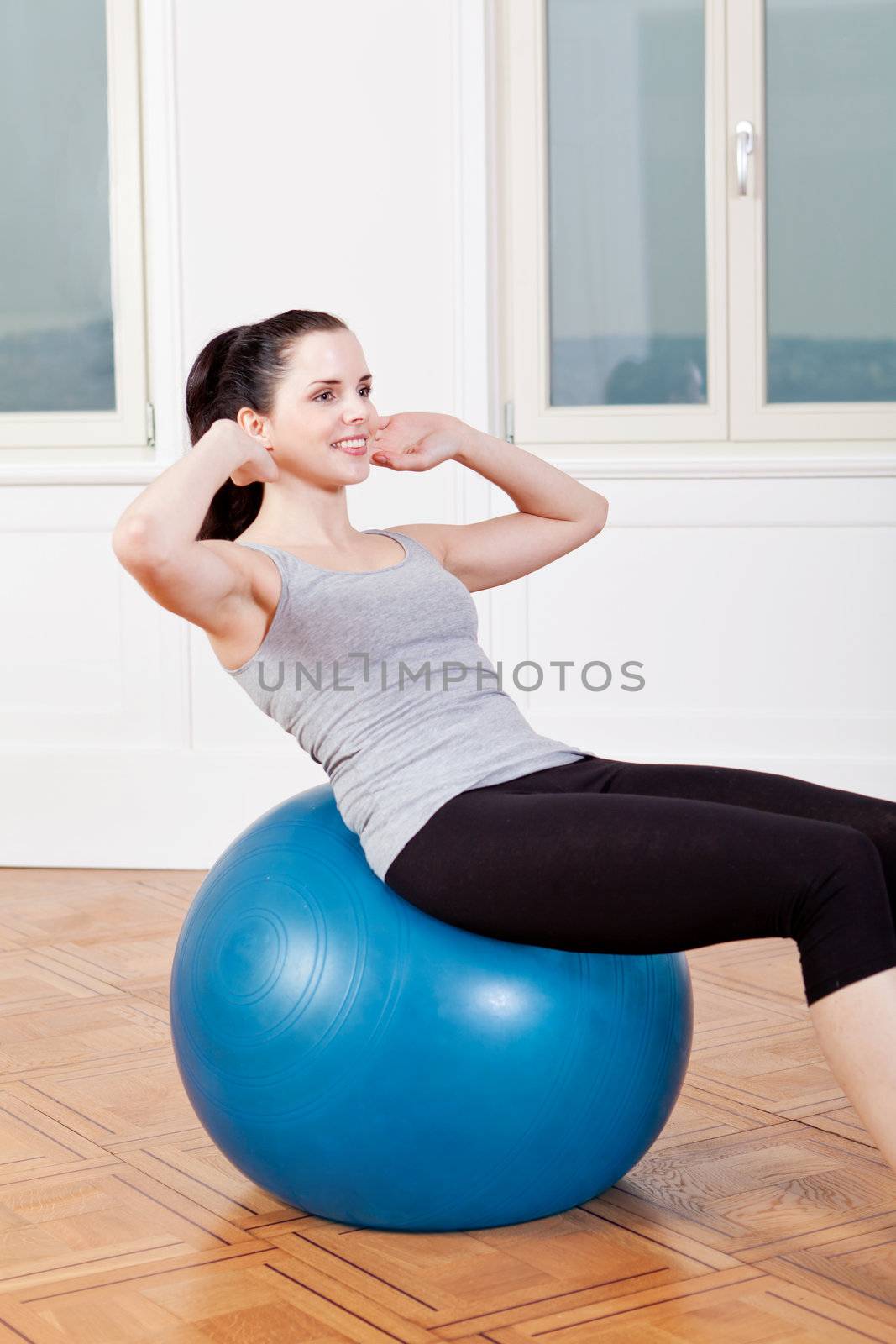 attractive young woman doing sit ups at home sport workout