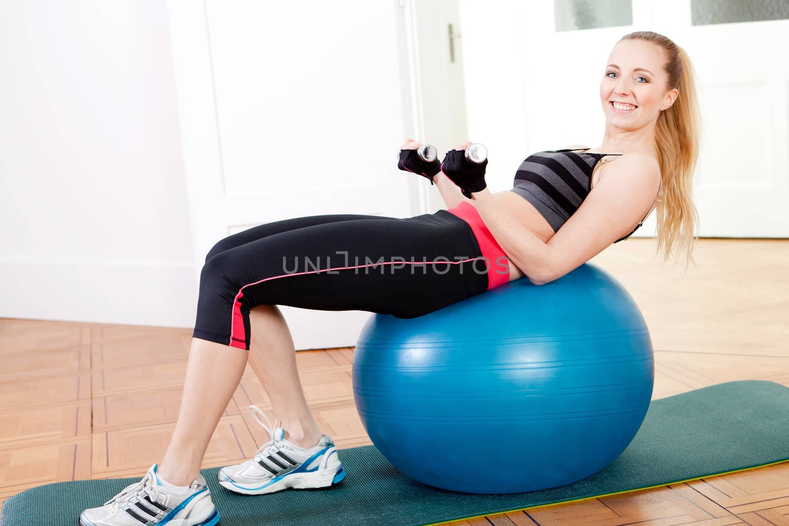 attractive young woman doing fitness dumbbell workout sport