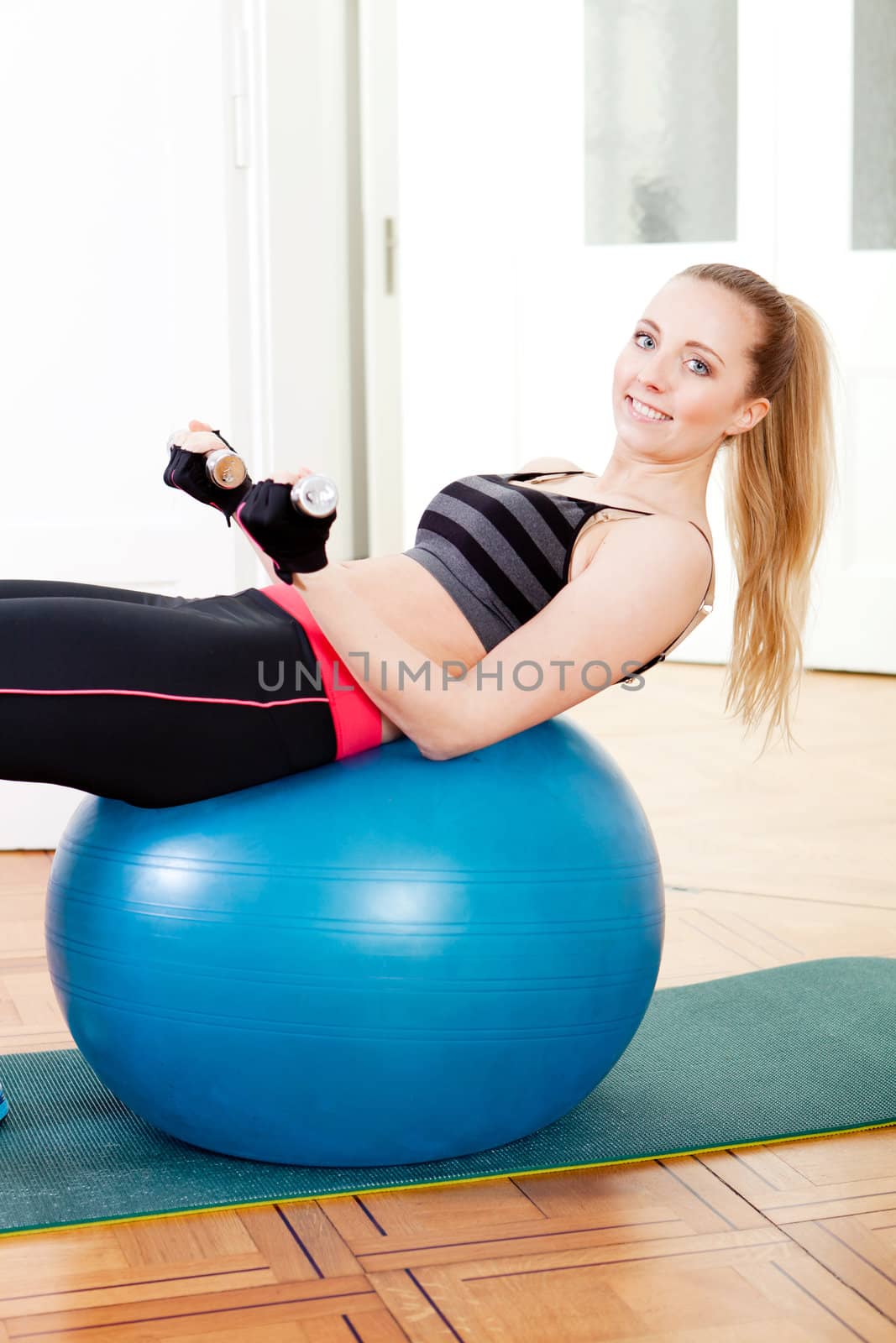 attractive young woman doing fitness dumbbell workout sport