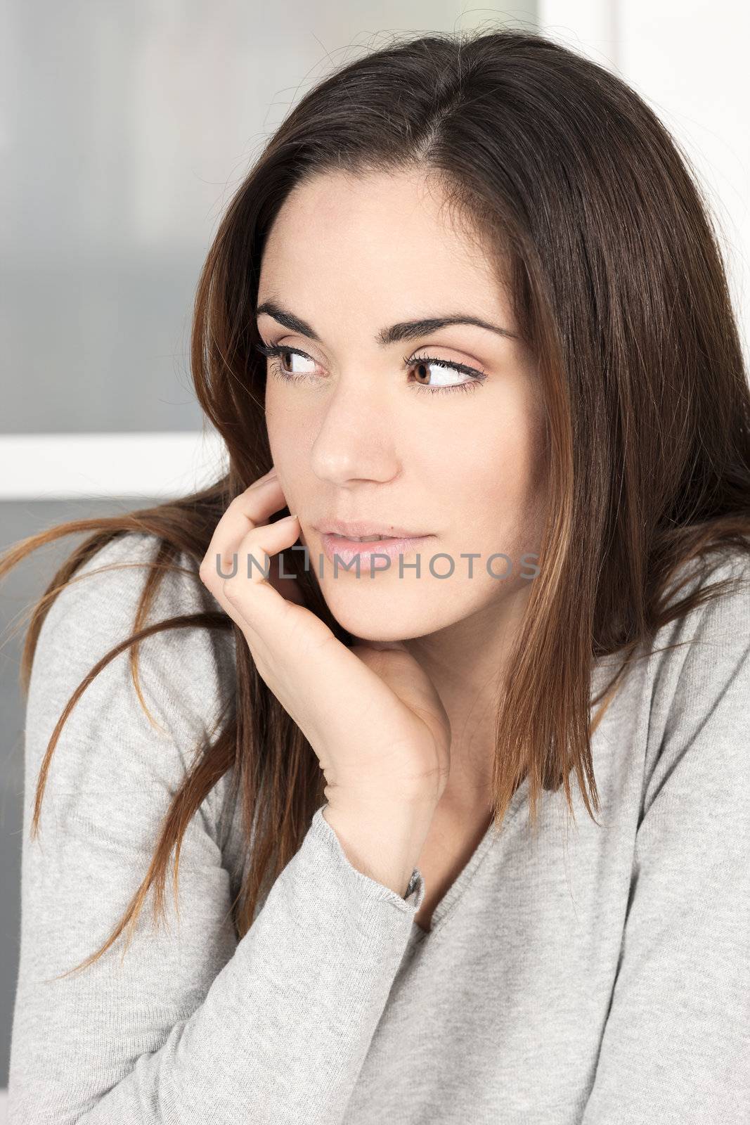 Portrait of cute young woman at home