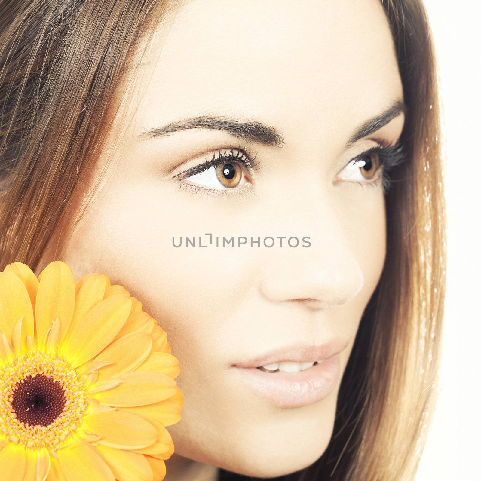Cute smiling woman portrait with flower 