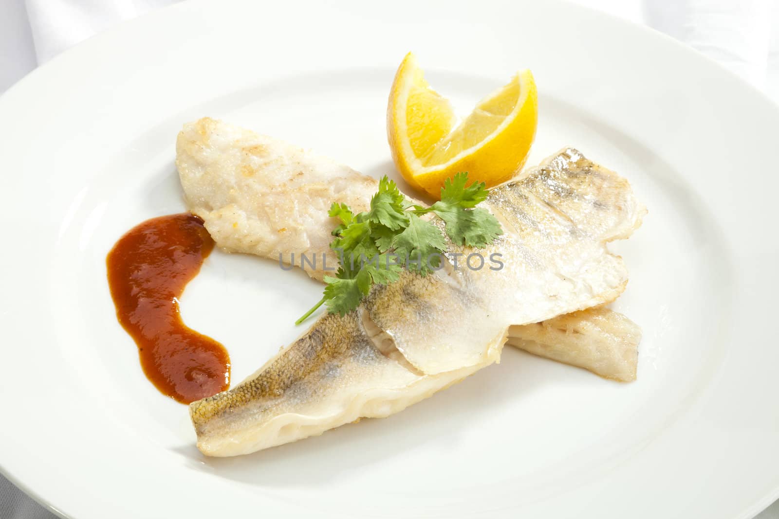 Grilled Pikeperch with lemon and tomato sauce