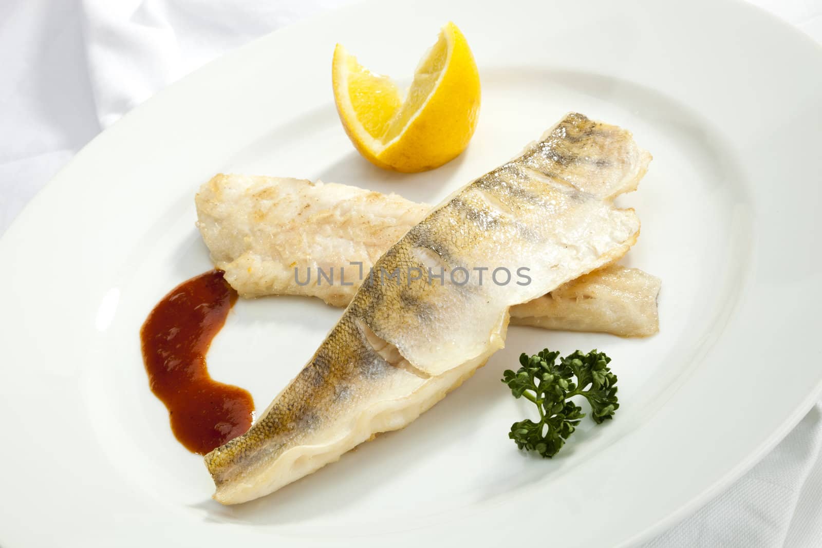 Grilled Pikeperch with lemon and tomato sauce