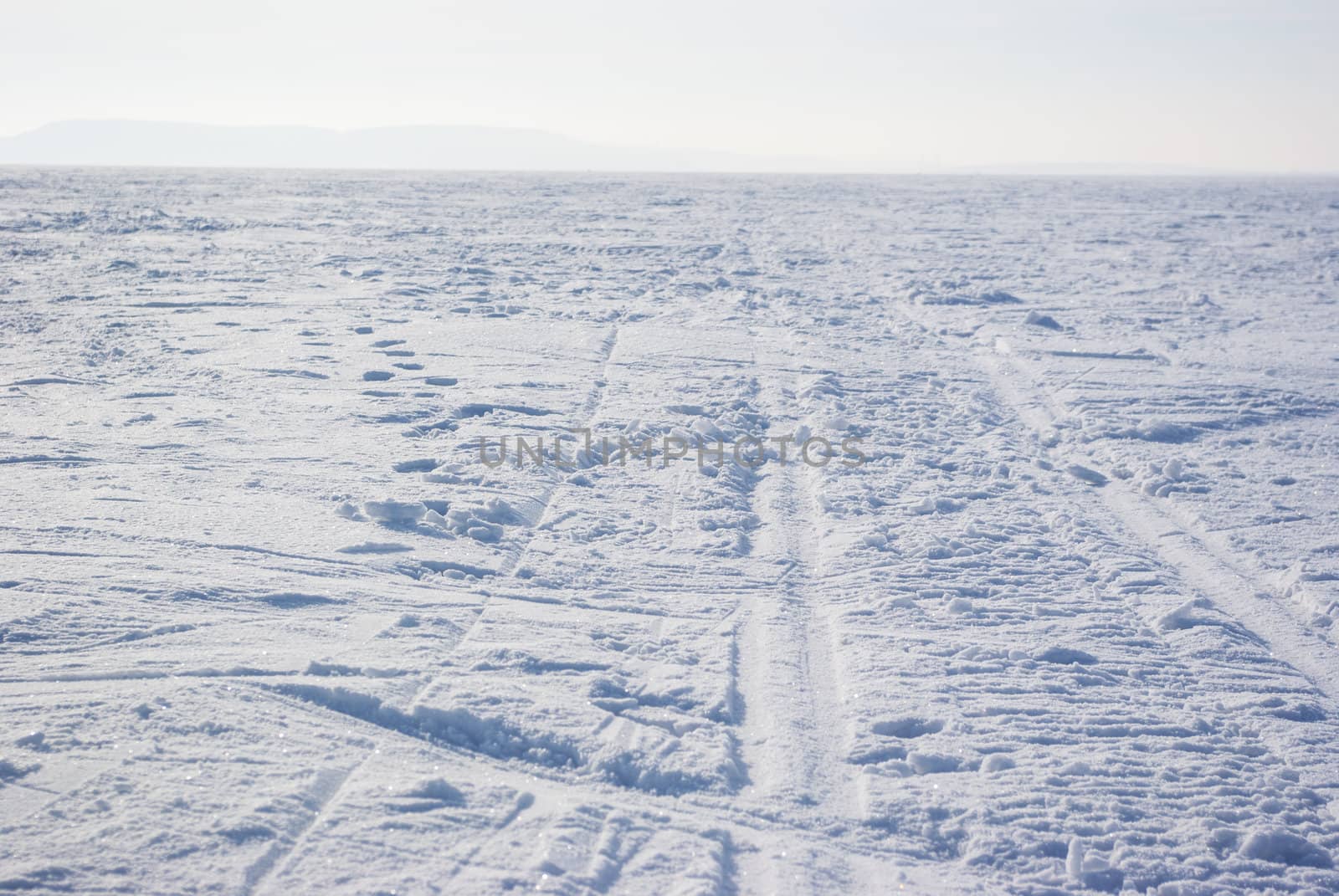 Footprints in the backdrop of snow-covered field