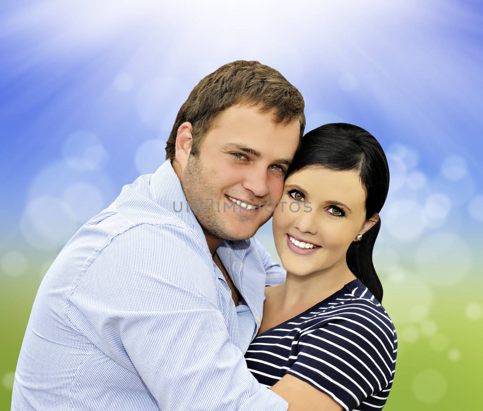 Beautiful happy  young couple with spring background by tish1