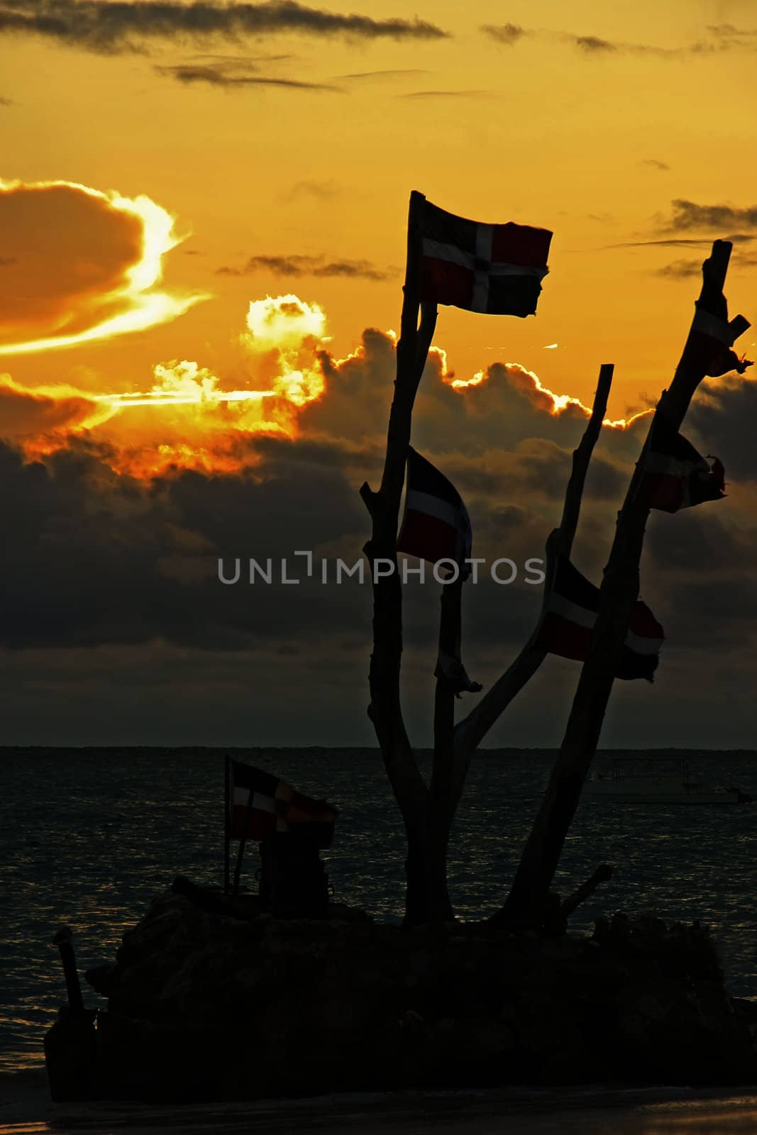 Dominican flags at sunrise on Bavaro beach, Dominican Republic