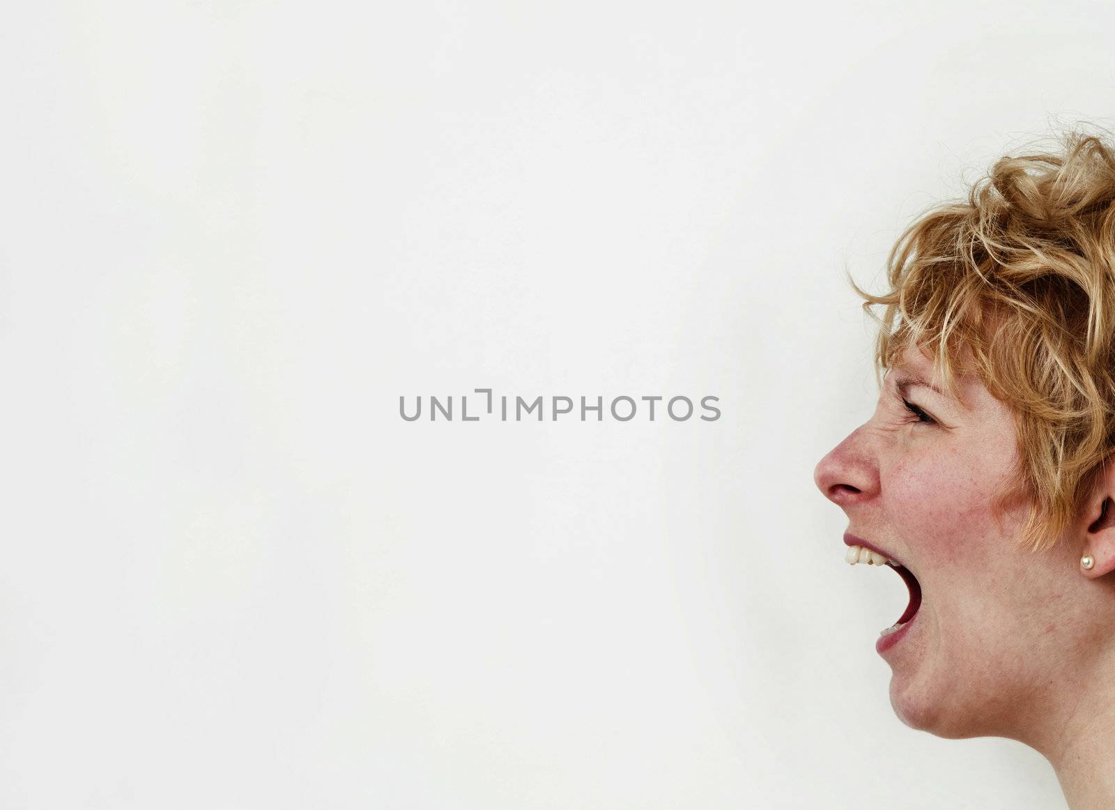 Young blond girl with morning look and mixed hairs on a white background