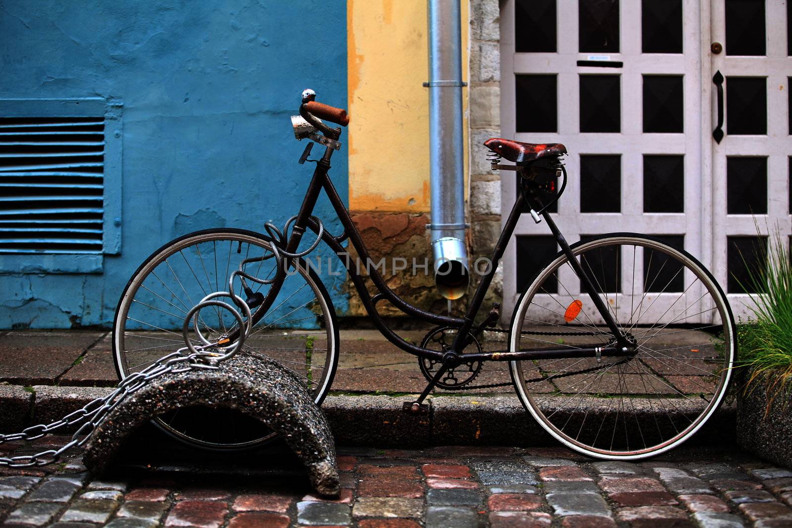 old bicycle on the lock close to