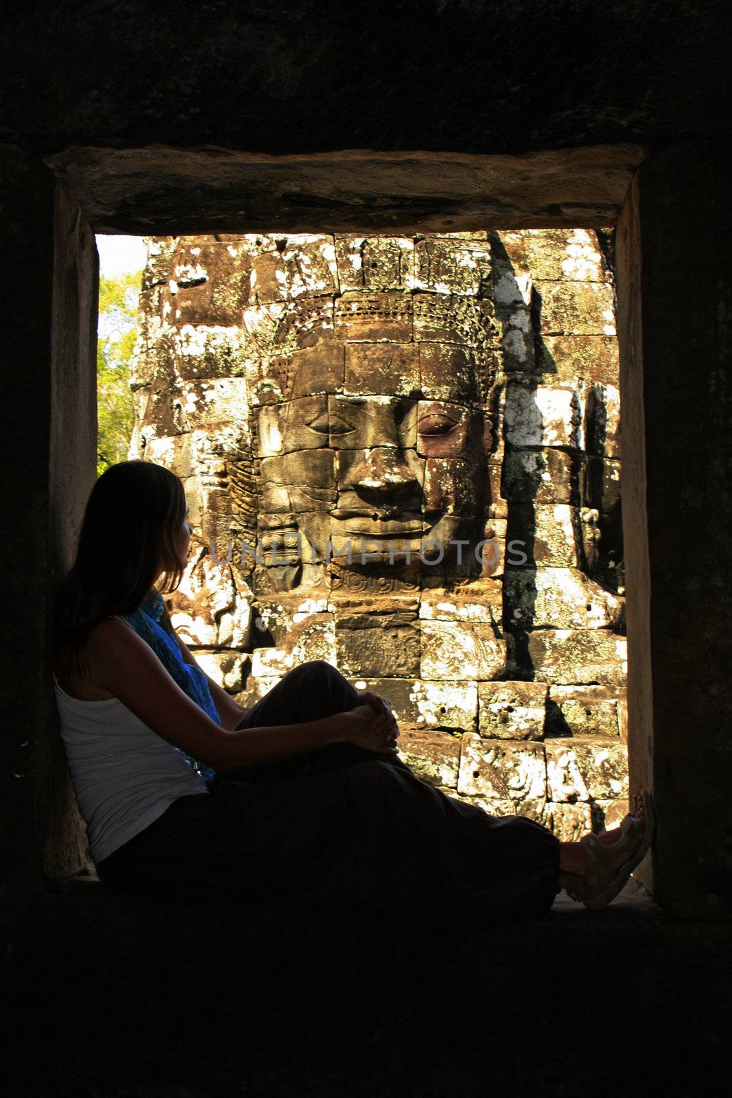 Silhouette of tourist admiring Bayon temple, Angkor area, Siem Reap, Cambodia