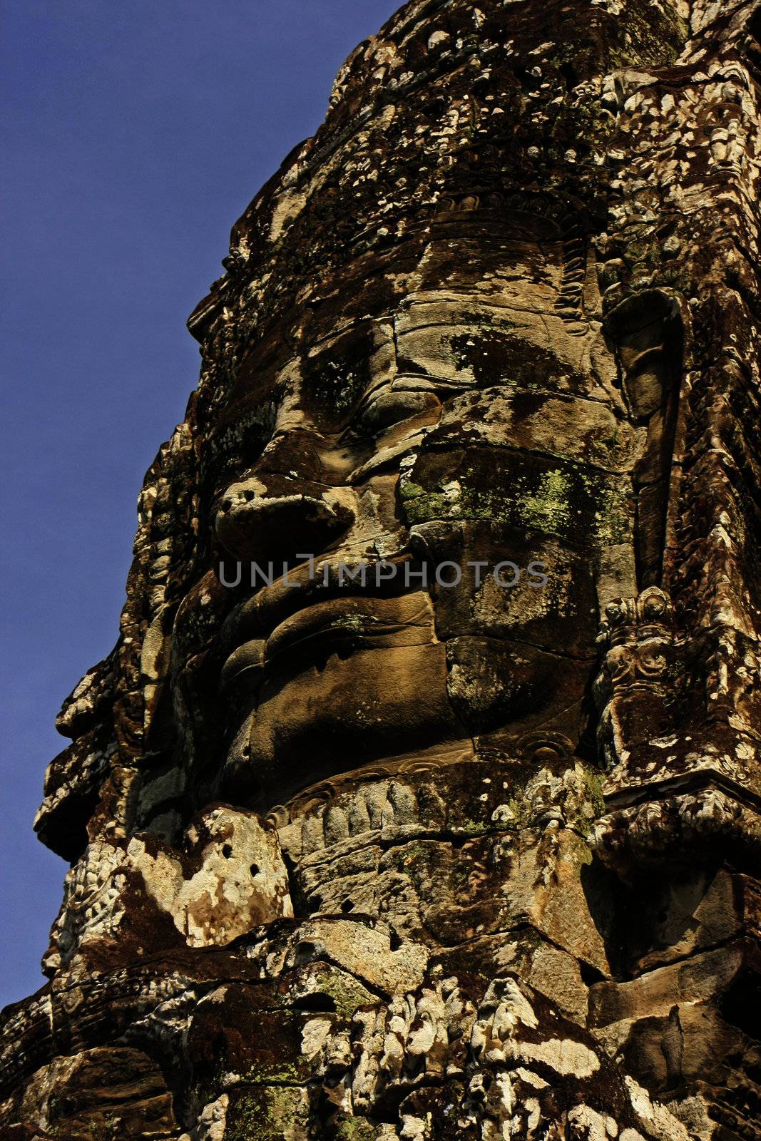 Stone face of Bayon temple, Angkor area by donya_nedomam