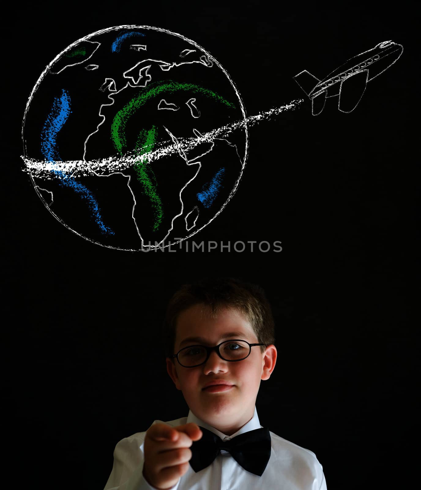Education needs you thinking boy dressed up as business man with chalk globe and jet world travel on blackboard background